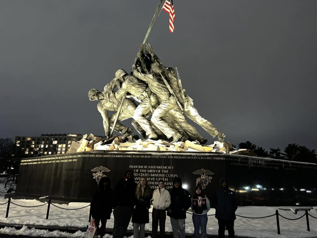 Seven KWC students stand in front of the Marine Corps War Memorial in Washington, D.C.