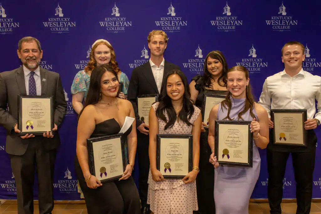 2026 Oak and Ivy inductees posing with plaques