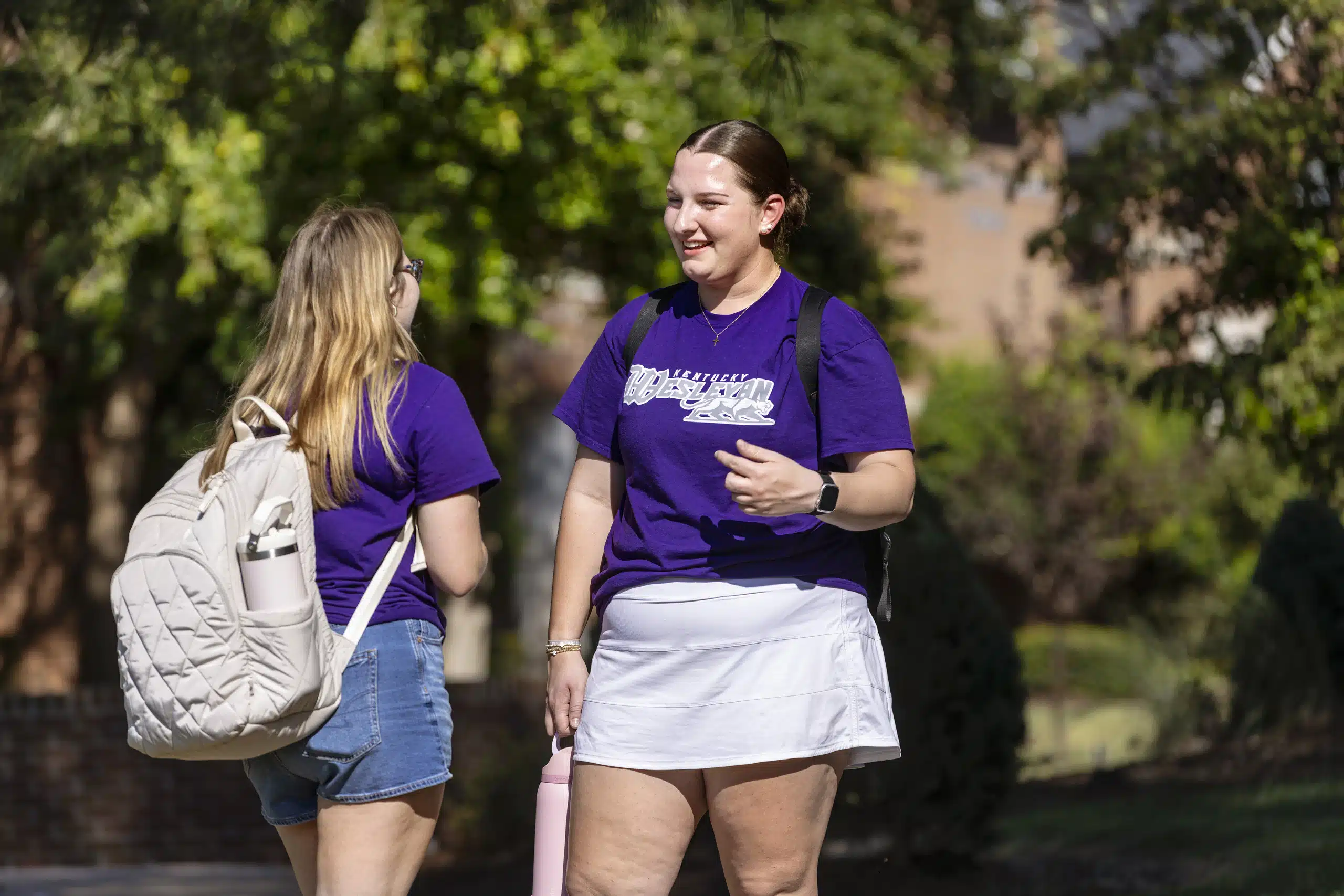 Two KWC students talking outside on campus