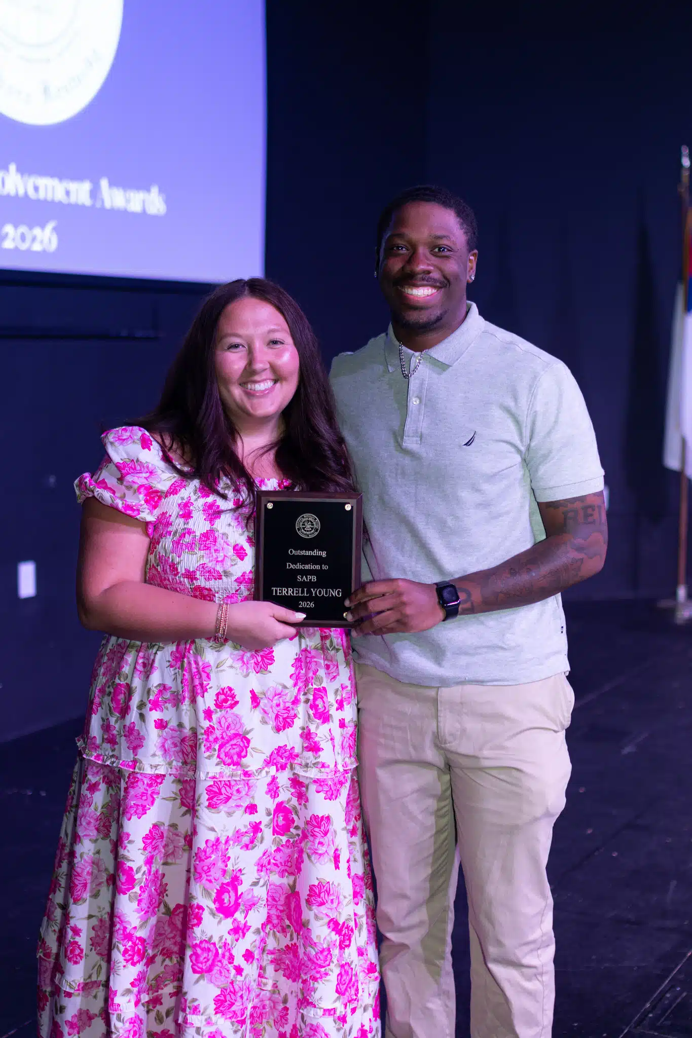 Student accepting plaque at 2026 Student Involvement Awards