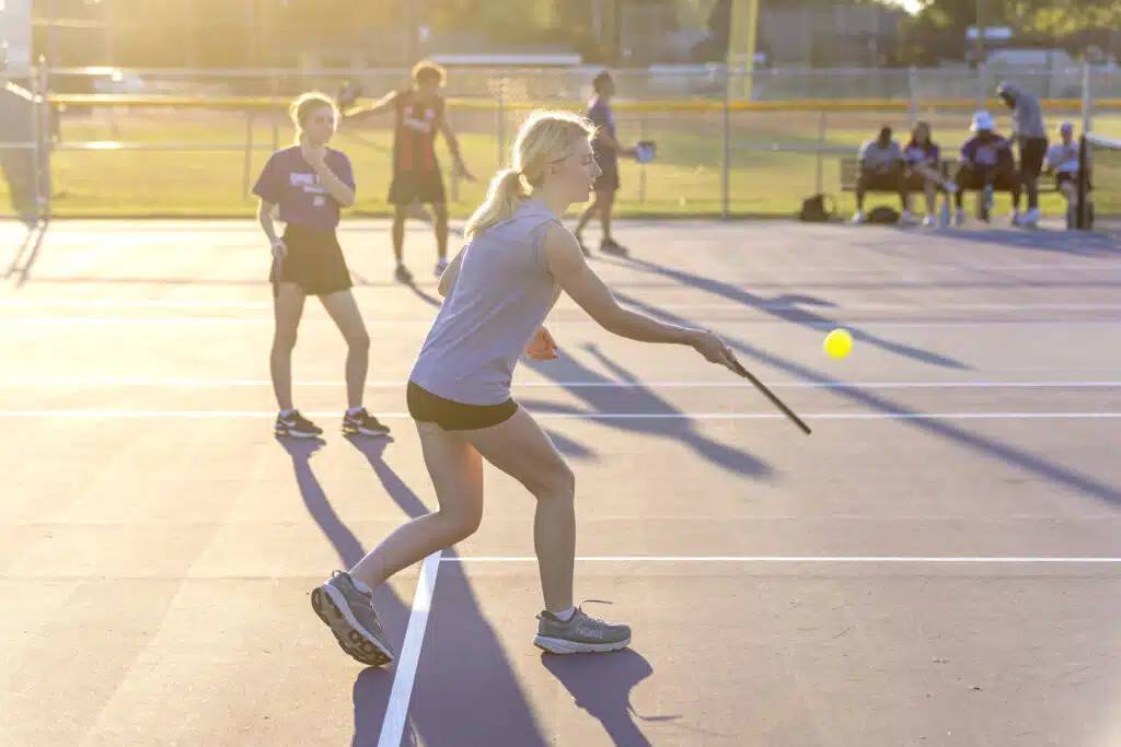 Students playing pickleball on the KWC tennis court