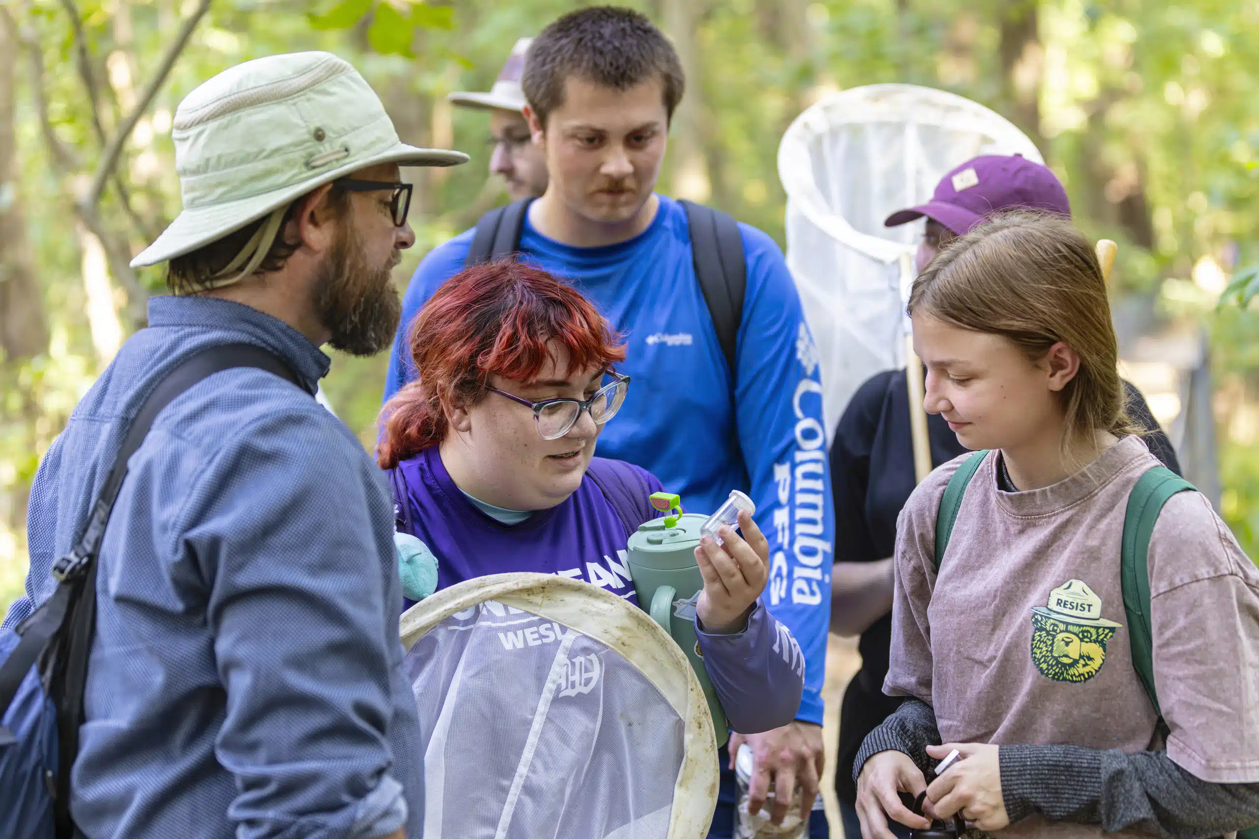 A group of Zoology students with their professor outside